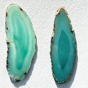 Polished agate slices, two 3 inch green pieces.